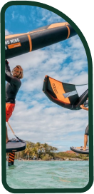 Two males wing foiling before and after a tack