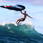 Wing foil surfing. A winger riding a wave