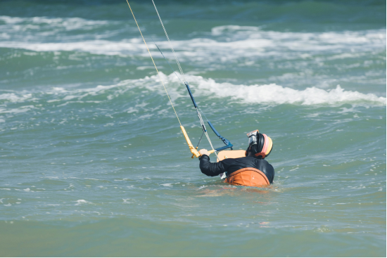 Kitesurfing lesson 2. Guy body dragging with board in fuerteventura