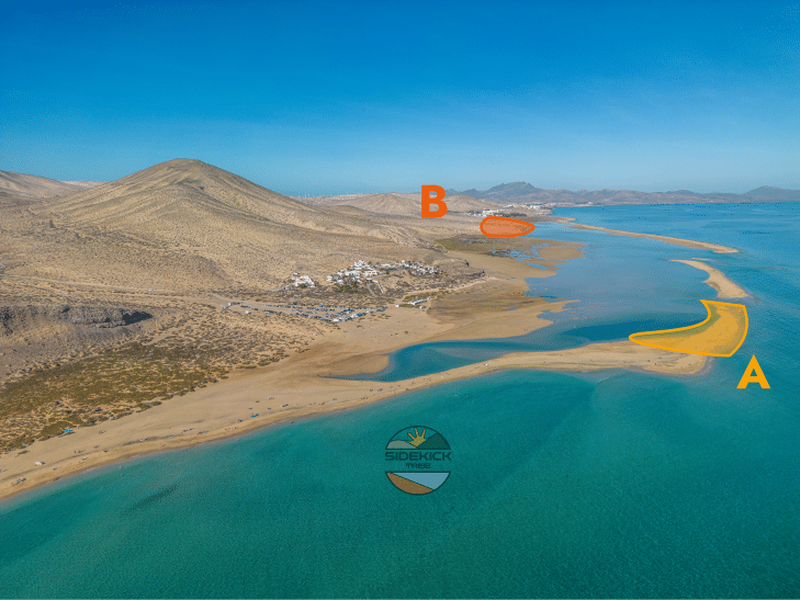 An aerial photo of Sotavento Lagoon, kitesurfers enjoy the clear blue waters of this spot and the unique phenomena of Tidal Lagoon.