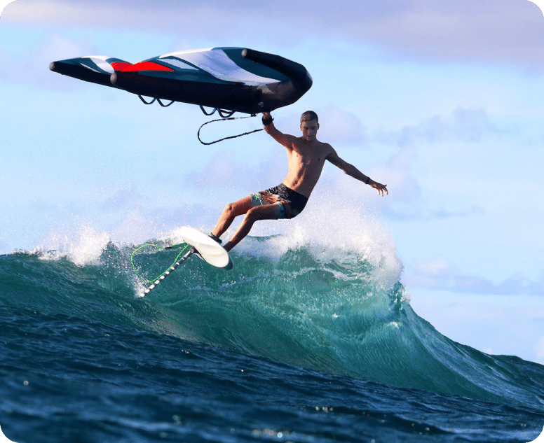 Wing foil surfing. A winger riding a wave