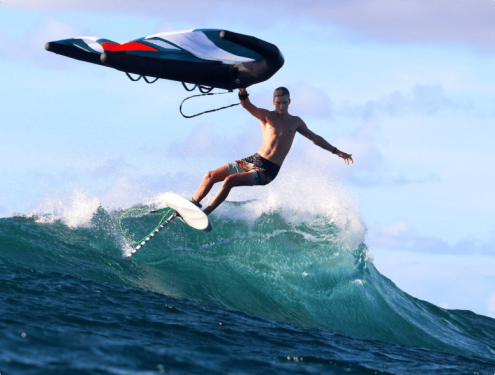 Wing foil surfing. A winger riding a wave